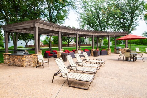 Enjoy lounging poolside under the pergola at Pointe Royal in Overland Park, KS