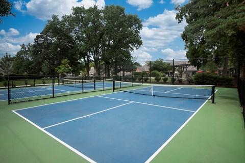 Enjoy a round of tennis on our courts at Pointe Royal in Overland Park, KS