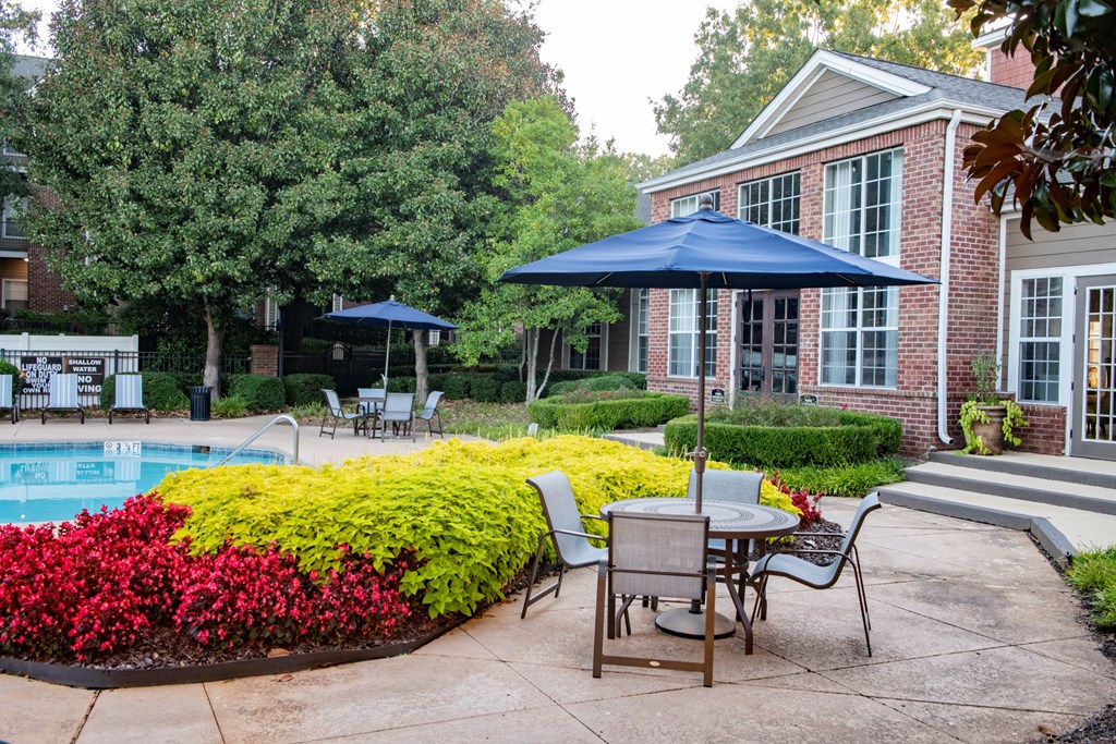 Tables and Chairs on Pool Deck at Polos at Hudson Corners Apartments, South Carolina 29650