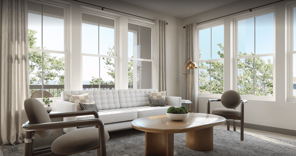 a living room with a white couch and a table at Livano Prosper, Prosper