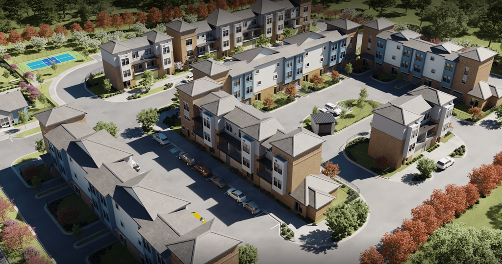 an aerial view of an apartment complex with cars in a parking lot at Livano Prosper, Texas