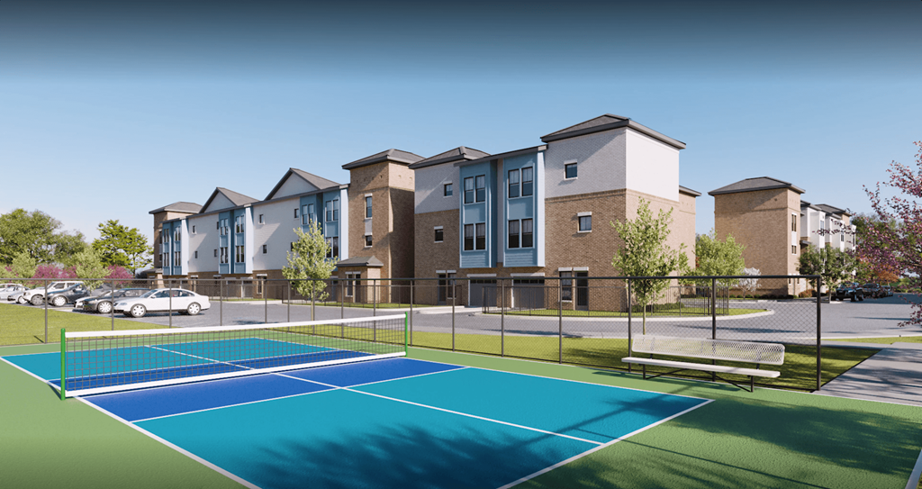 a tennis court with apartments in the background at Livano Prosper, Prosper, 75078