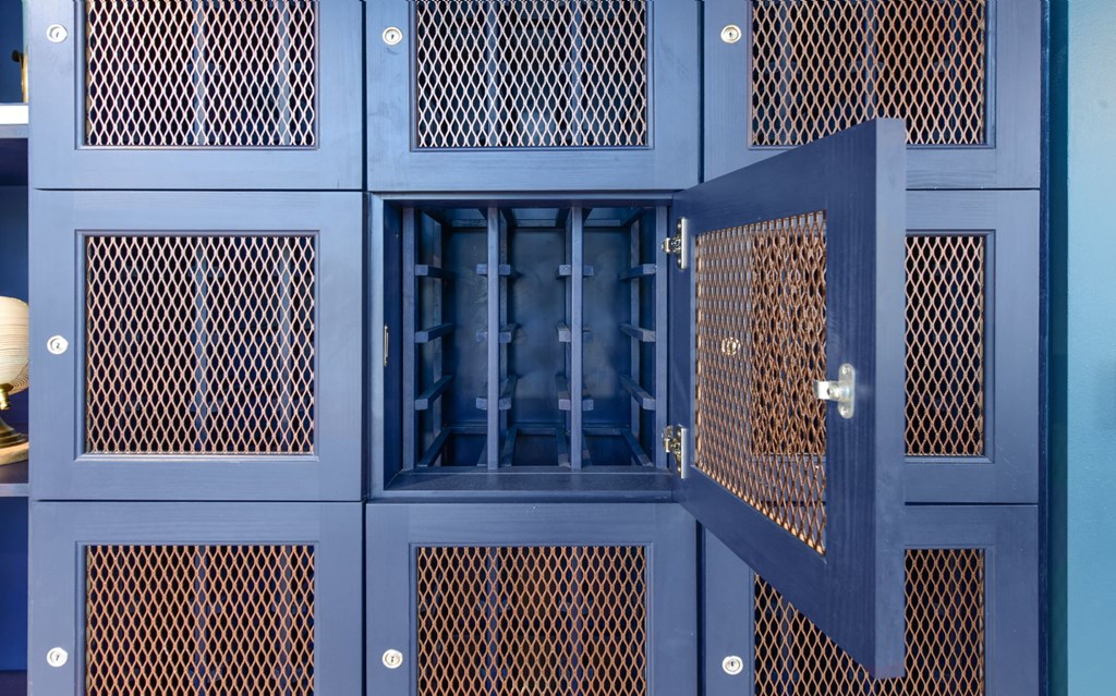 a blue cabinet with a window and blue doors