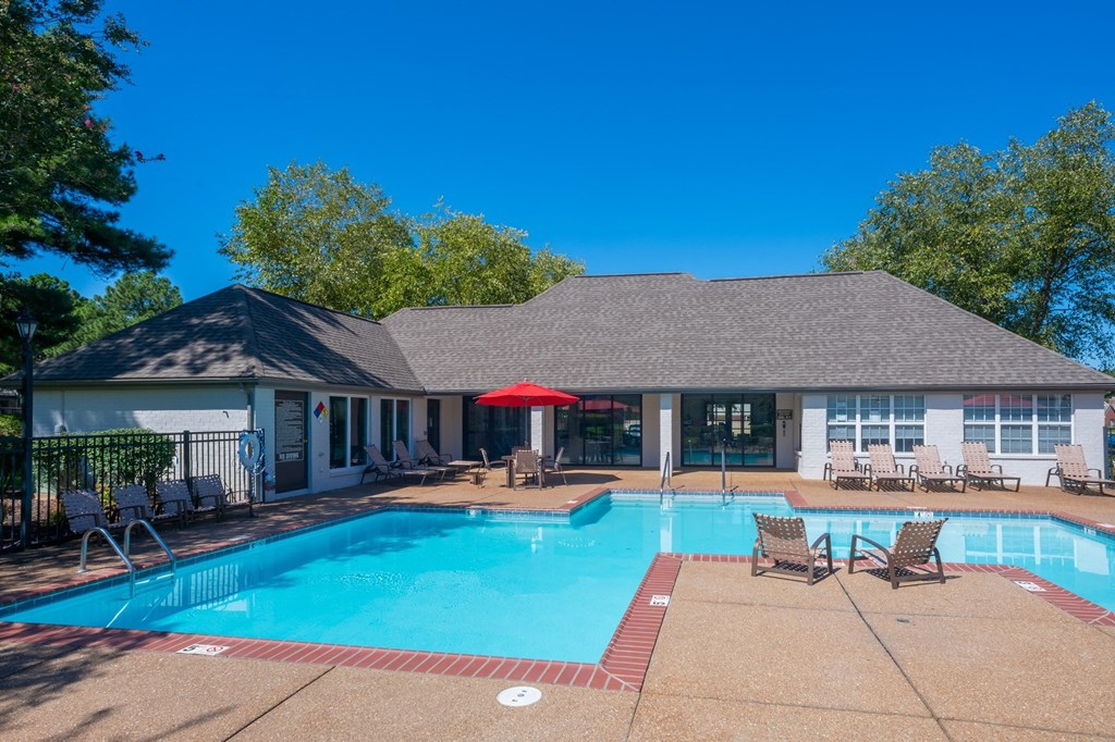 a swimming pool with a building in the background  at The Addison at Collierville, Collierville