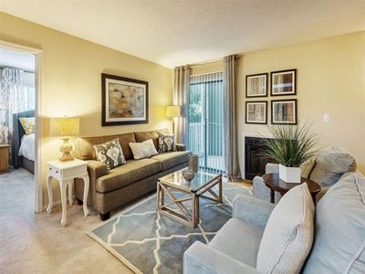 Bright Open Den Living Space with Cozy Fireplaces and Amble Room for Couches and Furniture at Rosemont Apartments, Roswell, GA 30076