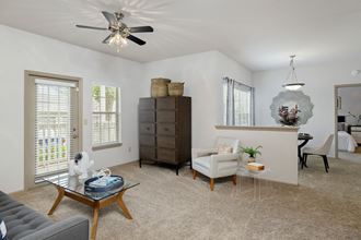 View of living room and dining room at Sandstone Creek Apartments , Overland Park, KS - Photo Gallery 3