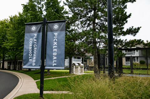 Two banners advertise playground and pickleball.