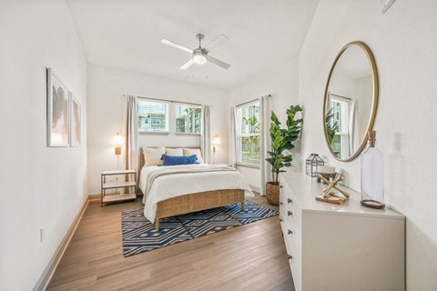 a bedroom with white walls and hardwood floors at Livano Springdale, Louisville, KY 40241