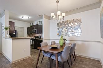 Dining Room located at St. Andrews Apartments in Johns Creek, GA 30022 - Photo Gallery 3