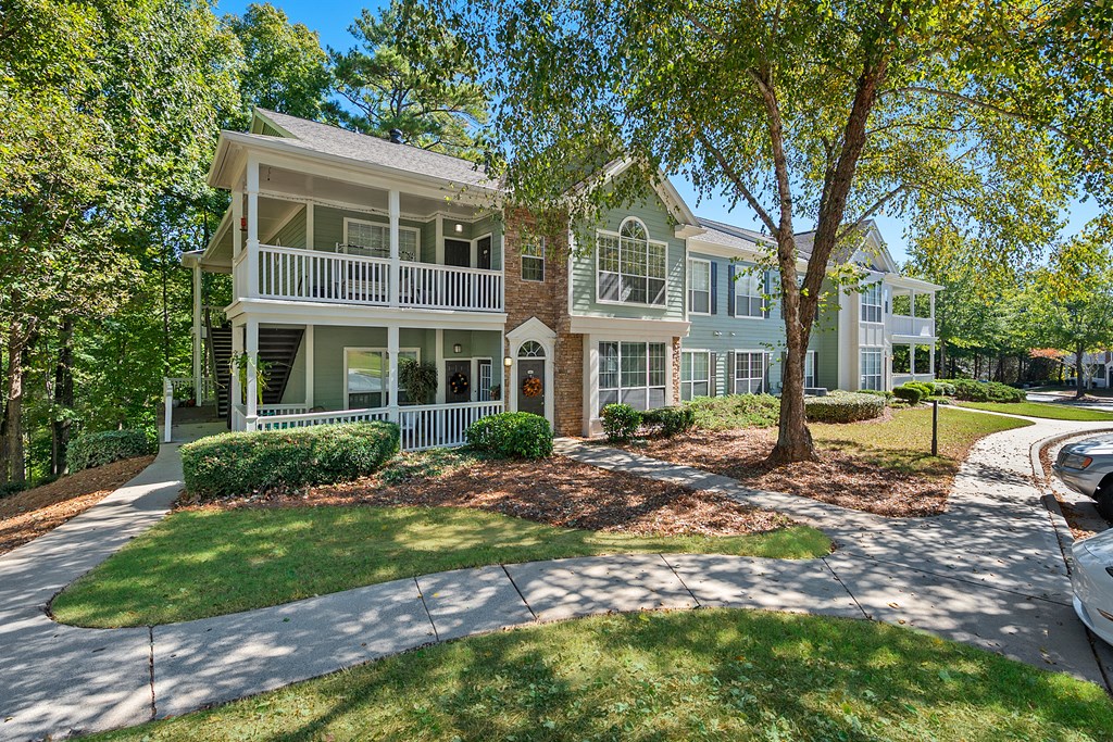 Building Exterior with Lush Landscaping  located at St. Andrews Apartments in Johns Creek, GA 30022