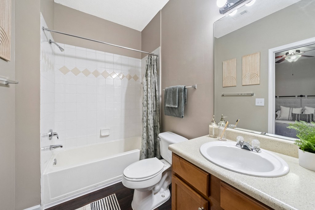 Secondary bathroom with tub/shower combo located  at Sugarloaf Crossings Apartments in Lawrenceville, GA 30046