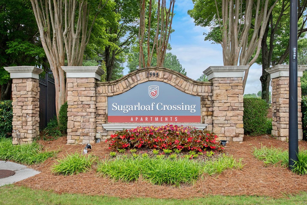 monument sign and landscaping at Sugarloaf Crossing Apartments, Lawrenceville GA 30046