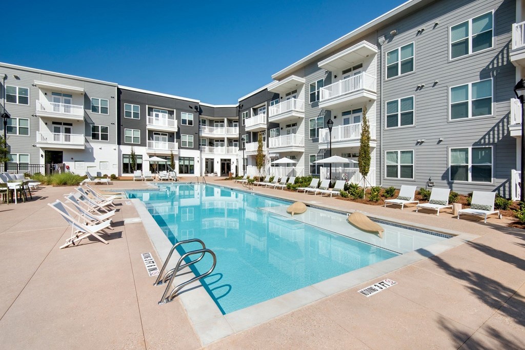 Refreshing swimming pool with sun ledge at The Barrett, Marietta, 30066