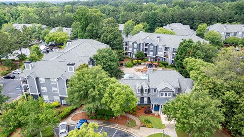 A bird's eye view of a residential area with houses and trees.