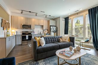 Model living room and kitchen at The Dartmouth North Hills Apartments, Raleigh, 27609