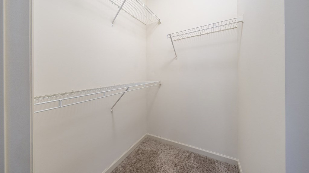 The Hendrix Apartments in Atlanta primary bedroom closet with shelving at The Hendrix, Georgia