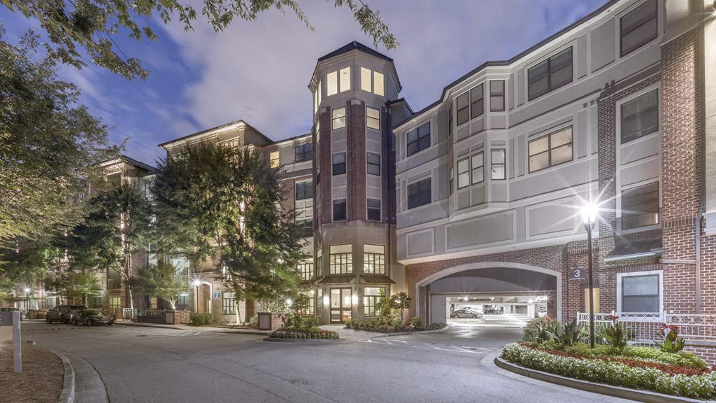 a street view of an apartment building at night at The Hendrix, Georgia, 30329