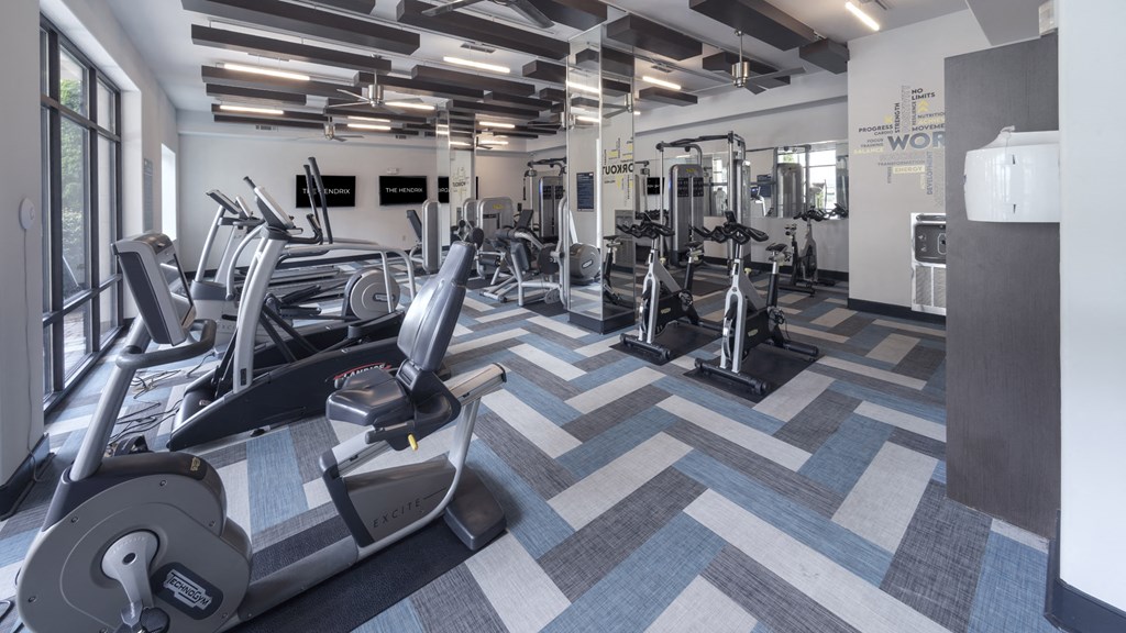 a gym with treadmills and other exercise equipment at The Hendrix, Atlanta, Georgia