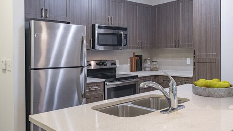 a kitchen with stainless steel appliances and a sink