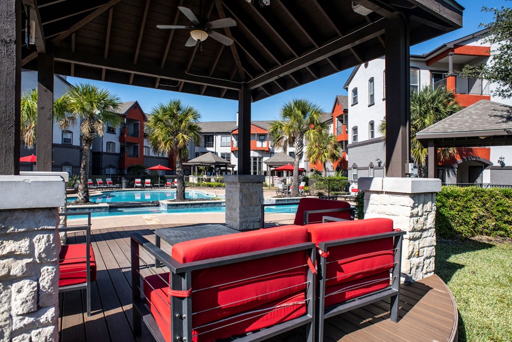 Comfortable Seating Area at Pool  located at Retreat at Steeplechase in Houston, TX 77065