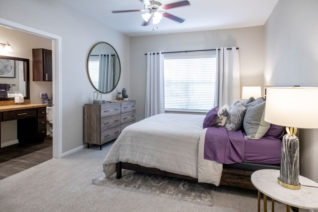 Main Bedroom with Ceiling Fan and Large Windows  located at Retreat at Steeplechase in Houston, TX 77065