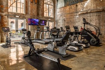 A gym with treadmills, stationary bikes, and a rowing machine. at The Tennessee Brewery, Memphis, Tennessee