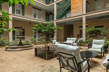 A courtyard with chairs and a fountain. at The Tennessee Brewery, Memphis, 38103