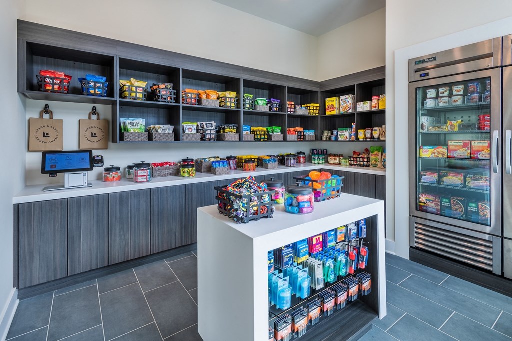a pantry with a white counter and shelves full of food