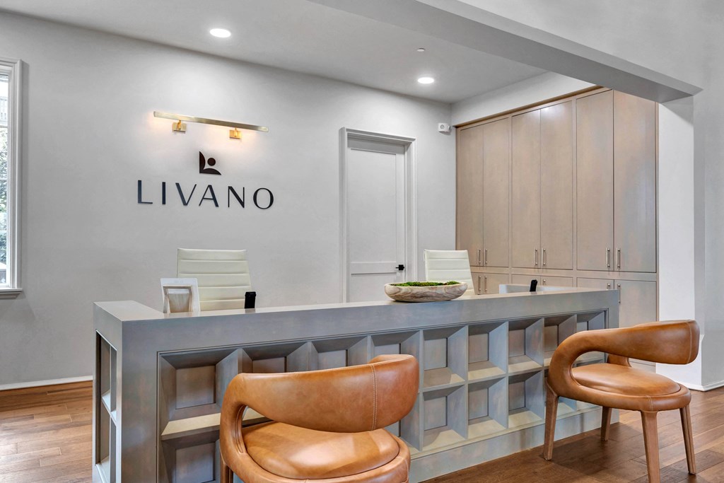 a reception area with a counter and chairs