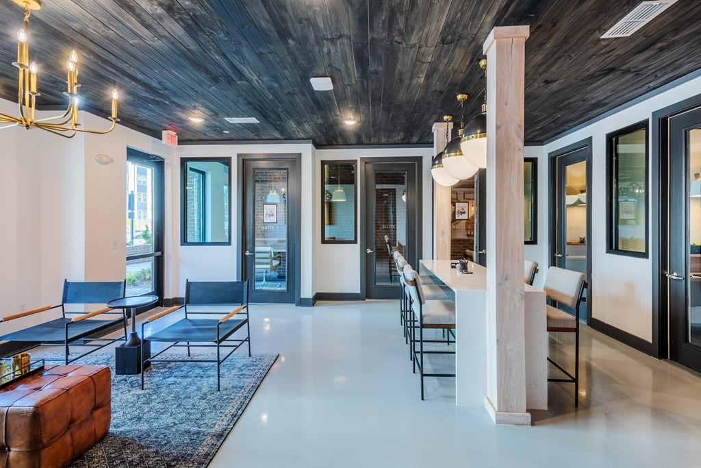 a lobby with a wooden ceiling and white flooring at The Livano Tryon, North Carolina, 28213