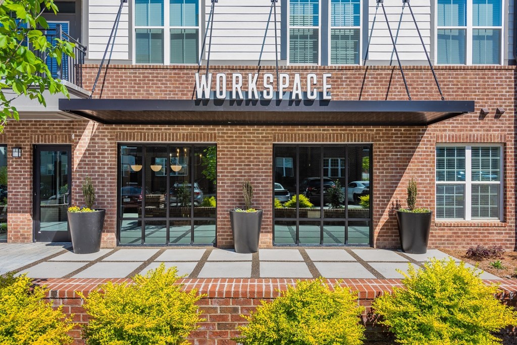 a brick building with a sign that reads workspace at The Livano Tryon, Charlotte, NC, 28213