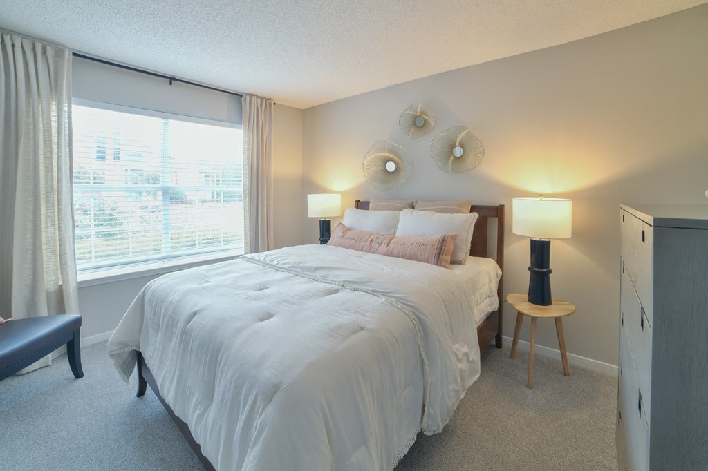 a bedroom with a bed and a large window at Twenty35 at Timothy Woods, Athens, Georgia