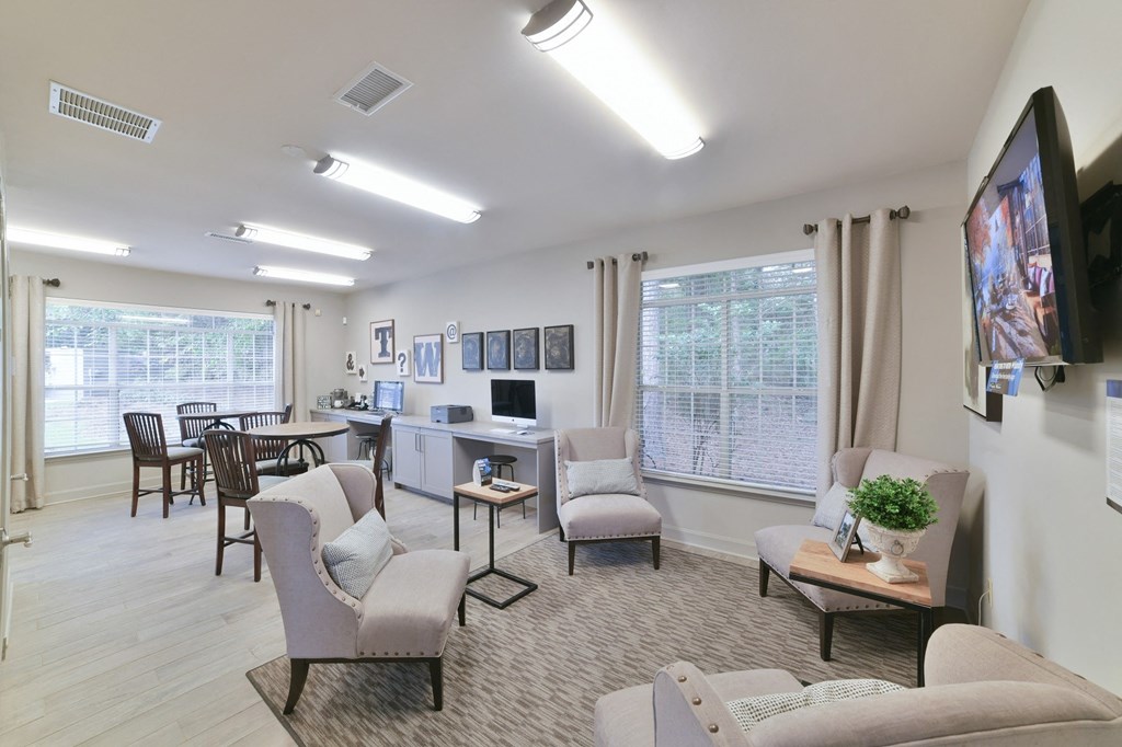 a living room with couches and chairs and a dining room with a table at Twenty35 at Timothy Woods, Athens