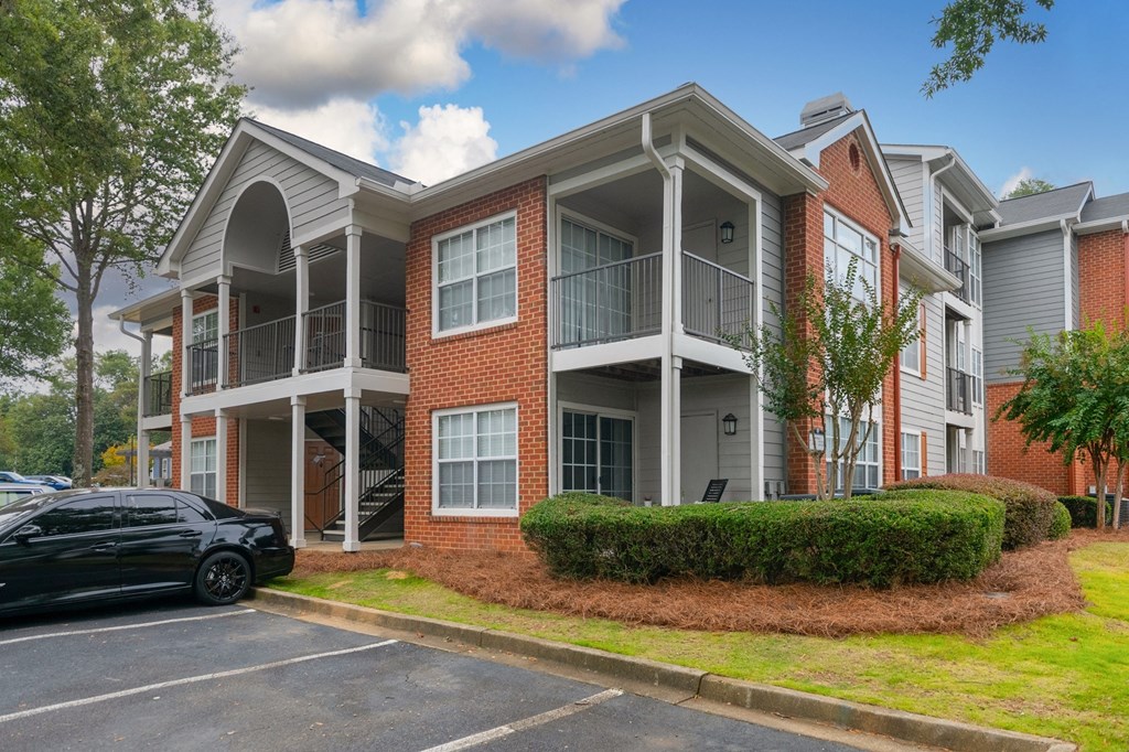 an apartment building with a car parked in front of it at Twenty35 at Timothy Woods, Athens