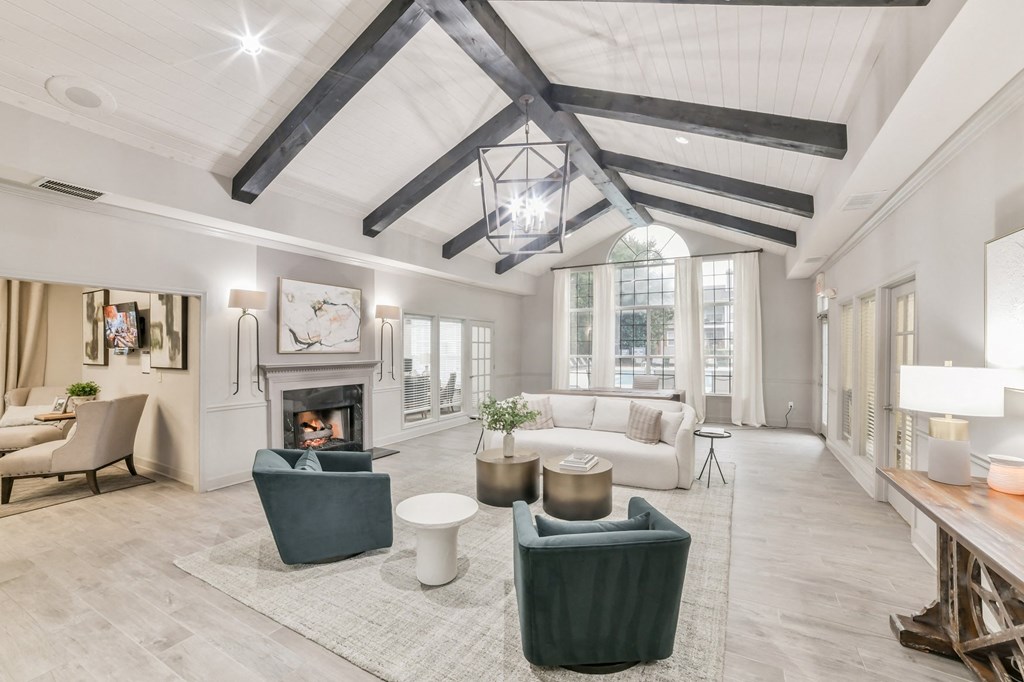 a living room with couches and chairs and a fireplace at Twenty35 at Timothy Woods, Athens