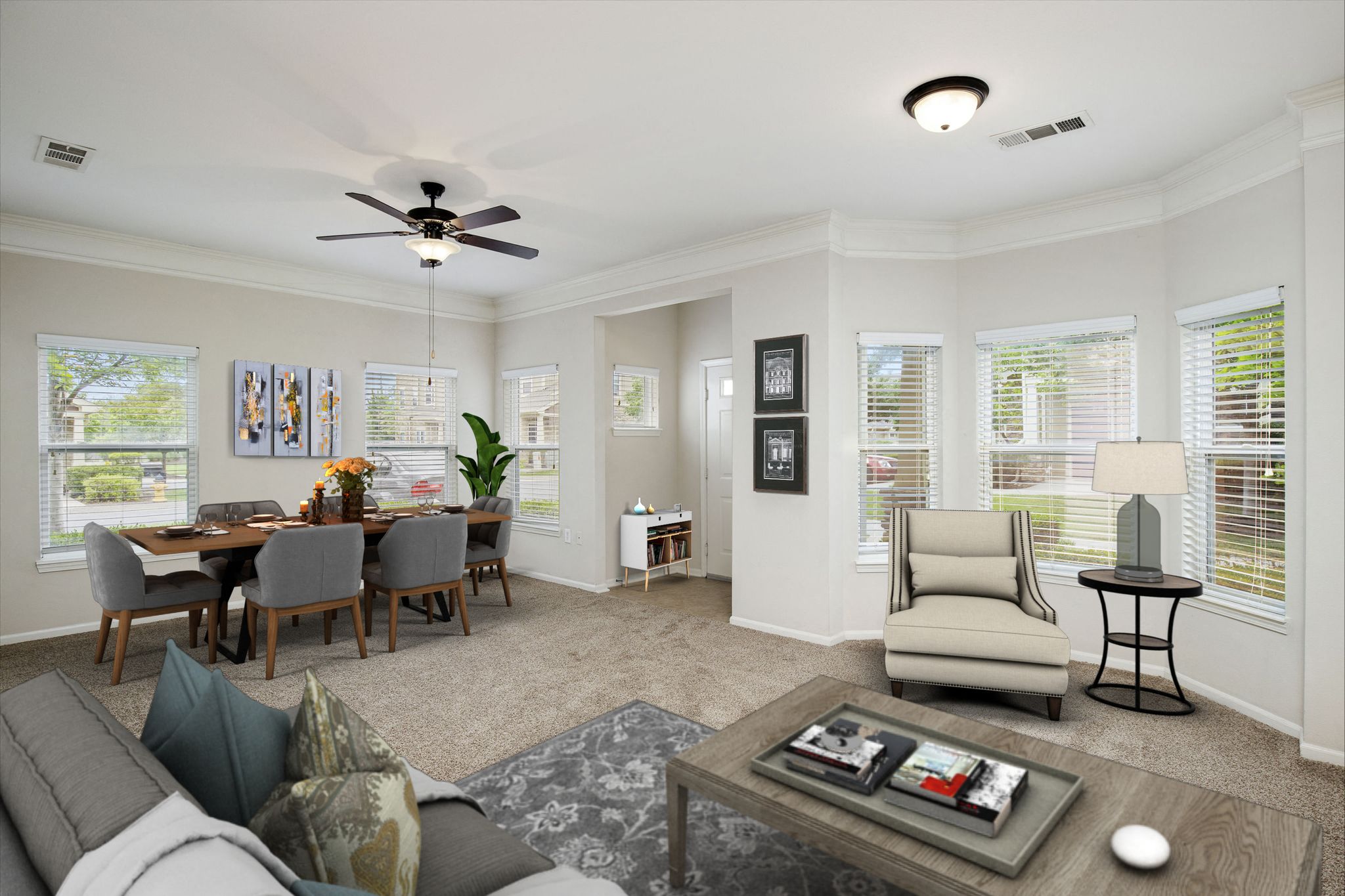 a living room with a couch and a table with chairs
