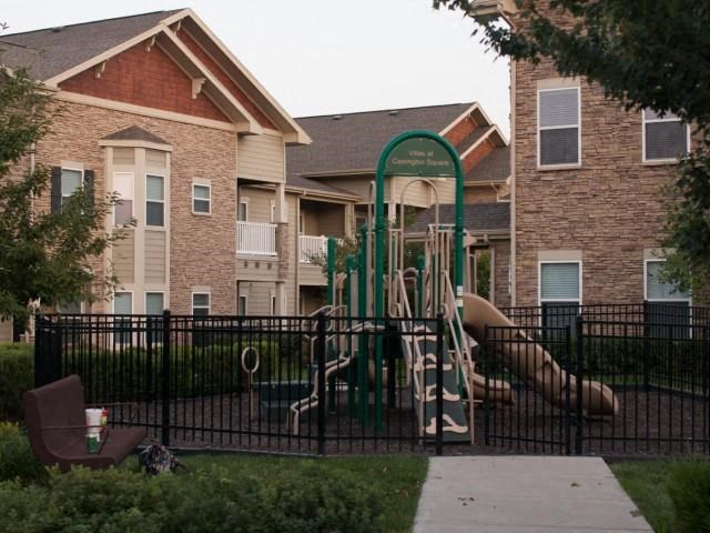 Children have a place to run and play at Villas too! Slides, Climbing Equipment and Bike Parking at Villas at Carrington Square Apartments, Overland Park, KS 66221