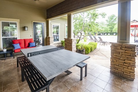 A patio with a table and chairs is shown.