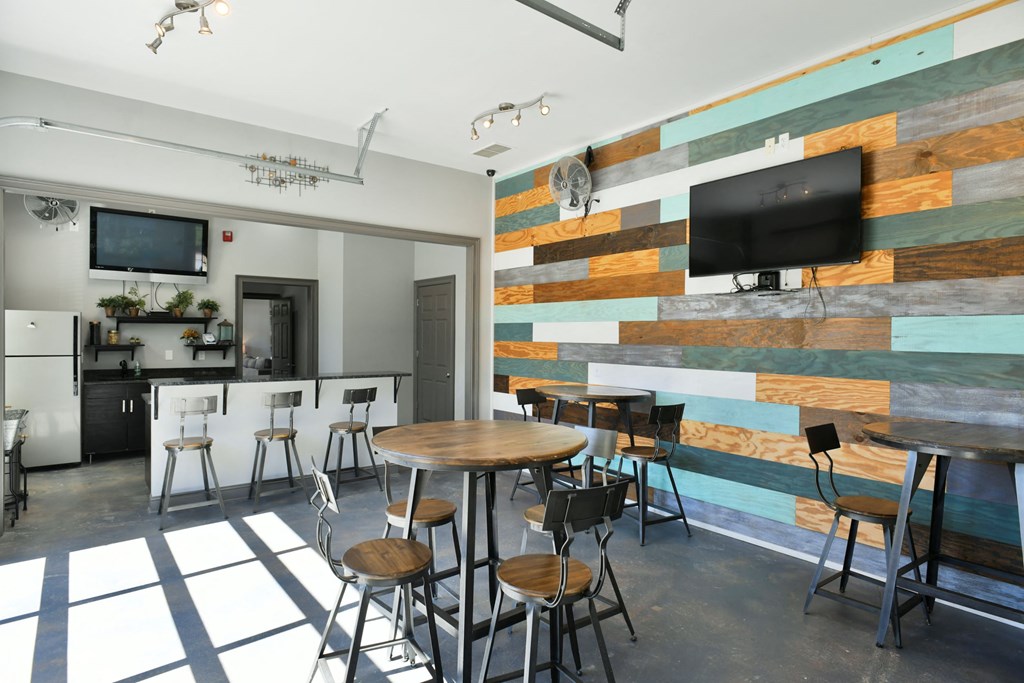 Clubhouse with Bar Stools and TV located at Walden Oaks, South Carolina