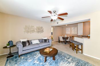 Sofa with center table in Living Room at Waterford Place, Louisville, Kentucky