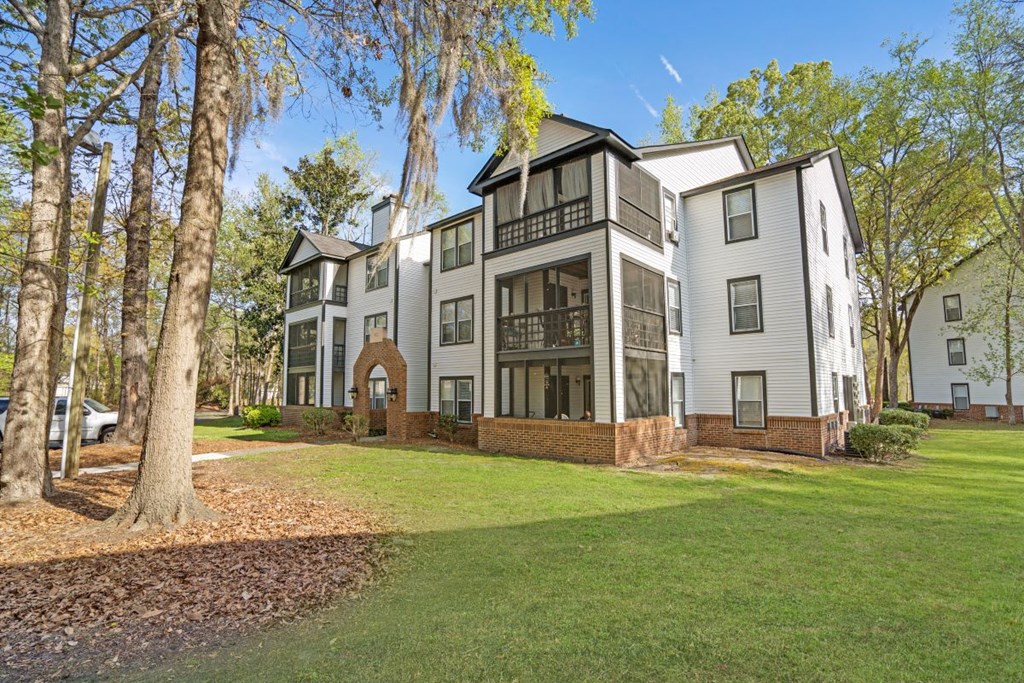 Residential building exterior with screened porches at Westbury Mews Apartments in Summerville SC 29485