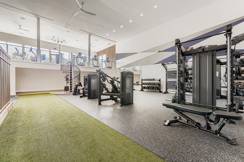 Two story fitness center with strength training equipment at Wood Terrace Apartments, Doraville, 30340
