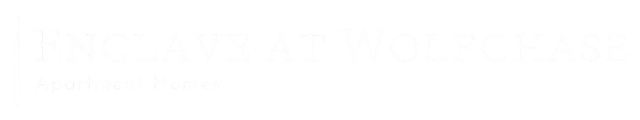 A black and white image of a sign that says "ENCLAVE AT WOLFCHASE Apartment Homes".