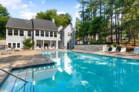 A large swimming pool in front of a house. at Manchester at Mansell, Roswell, GA 30076 