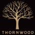 A tree with the word Thornwood below it.