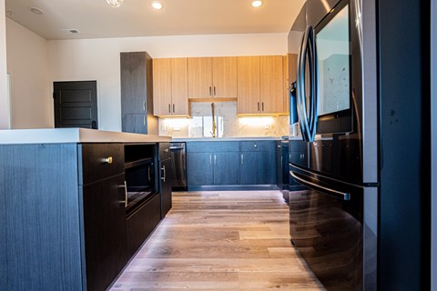 Kitchen with a long white countertop at Chelsea Apartments, St Louis, 63112