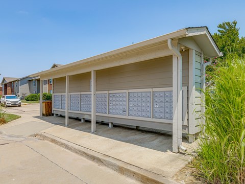 A small building with a long row of windows on the side.