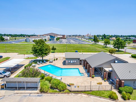 A large building with a pool in front.
