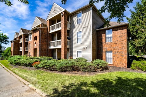 A large apartment complex with multiple balconies and windows.