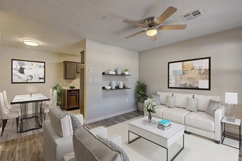 A living room with a white couch and a coffee table.